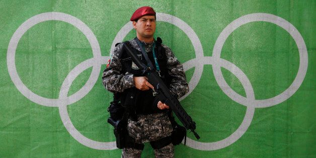 2016 Rio Olympics - Lagoa - 30/07/2016. A police officer stands at the Olympic rowing venue.    REUTERS/Stefan Wermuth  TPX IMAGES OF THE DAY
