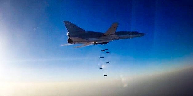 In this frame grab provided by Russian Defence Ministry press service, Russian long range bomber Tu-22M3 flies during an air strike over Aleppo region of Syria on Tuesday, Aug. 16, 2016. Russia's Defense Ministry said on Tuesday Russian warplanes have taken off from a base in Iran to target Islamic State fighters in Syria. (Russian Defence Ministry Press Service photo via AP)