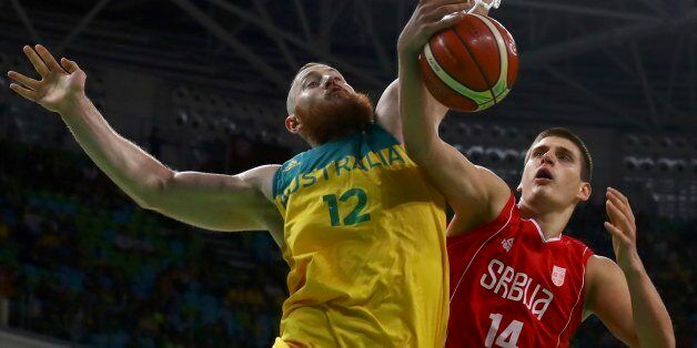 2016 Rio Olympics - Basketball - Semifinal - Men's Semifinal Australia v Serbia - Carioca Arena 1 - Rio de Janeiro, Brazil - 19/8/2016. Nikola Jokic (SRB) of Serbia and Aron Baynes (AUS) of Australia in action. REUTERS/Jim Young  FOR EDITORIAL USE ONLY. NOT FOR SALE FOR MARKETING OR ADVERTISING CAMPAIGNS.