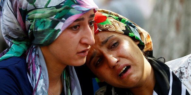 Women mourn as they wait in front of a hospital morgue in the Turkish city of Gaziantep, after a suspected bomber targeted a wedding celebration in the city, Turkey, August 21, 2016. REUTERS/Osman Orsal