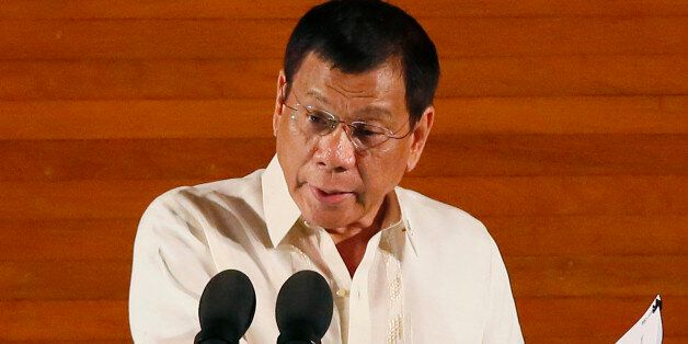 FILE - In this Monday,  July 25, 2016 file photo, Philippine President Rodrigo Duterte delivers his first State of the Nation Address before the joint session of the 17th Congress in suburban Quezon city, northeast of Manila, Philippines. Duterte on Thursday, July 28, threatened to withdraw a ceasefire order he gave three days ago after suspected communist rebels killed a government militiaman and wounded four others in an attack. (AP Photo/Bullit Marquez, File)