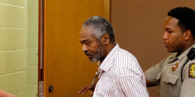 Martin Blackwell is led out of a courtroom after being found guilty during his trial in Atlanta, Wednesday, Aug. 24, 2016. Blackwell was convicted of pouring hot water on two gay men as they slept and sentenced to 40 years in prison. (AP Photo/John Bazemore)