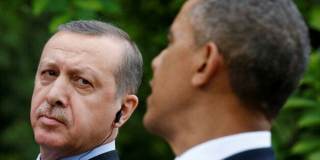 FILE PHOTO -  Turkish Prime Minister Recep Tayyip Erdogan (L) listens as U.S. President Barack Obama (R) addresses a joint news conference in the White House Rose Garden in Washington, May 16, 2013.   REUTERS/Kevin Lamarque/File Photo