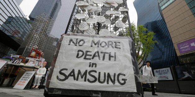 In this April 22, 2016 photo, messages for victims who were former employees at Samsung semiconductor factories are displayed outside of Samsung buildings in Seoul, South Korea. An Associated Press investigation has found South Korean authorities have, at Samsungâs request, repeatedly withheld crucial information about the chemicals that workers were exposed to at its computer chip and liquid crystal display factories. Workers who have fallen ill due to the chemicals have the right to acces