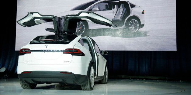 The Model X car is unveiled at the company's headquarters Tuesday, Sept. 29, 2015, in Fremont, Calif.  (AP Photo/Marcio Jose Sanchez)