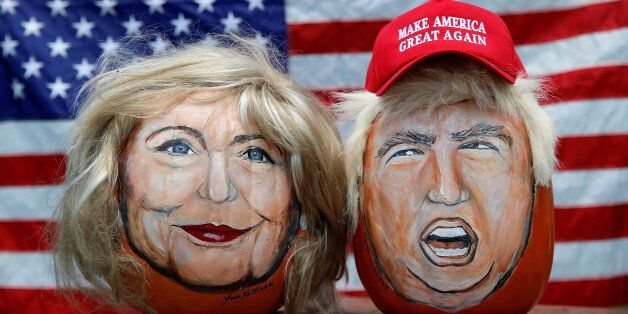 The images of U.S. Democratic presidential candidate Hillary Clinton (L) and Republican Presidential candidate Donald Trump are seen painted on decorative pumpkins created by artist John Kettman in LaSalle, Illinois, U.S., June 8, 2016.     REUTERS/Jim Young      TPX IMAGES OF THE DAY