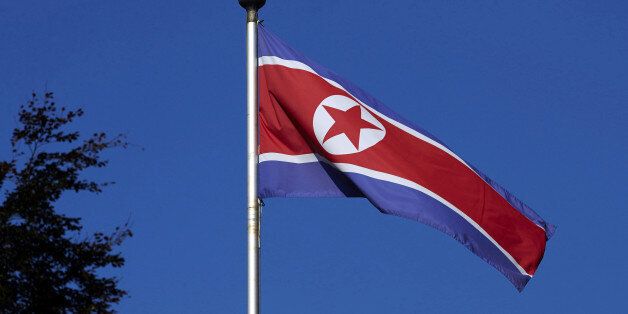 A North Korean flag flies on a mast at the Permanent Mission of North Korea in Geneva October 2, 2014. REUTERS/Denis Balibouse/File Photo