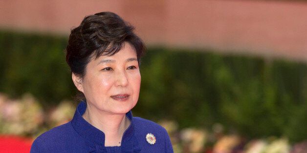 South Korea's President Park Geun-hye walks to participate in the 18th ASEAN-Republic of Korea summit, a parallel summit in the ongoing 28th and 29th ASEAN Summits at National Convention Center in Vientiane, Laos, Wednesday, Sept. 7, 2016. (AP Photo/Gemunu Amarasinghe)