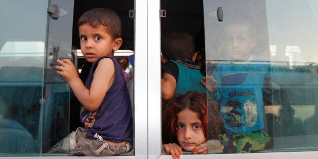 Displaced Iraqi children, who had fled to Syria to escape the violence in Mosul, transfer to a refugee camp in Kirkuk as they return to Iraq September 10, 2016.   REUTERS/Ako Rasheed