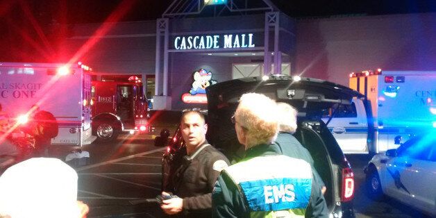 Medics wait to gain access to the Cascade Mall after four people were shot dead in Burlington, Washington, U.S. September 24, 2016.  Sgt Mark Francis/Washington State Patrol/Handout via Reuters ATTENTION EDITORS - THIS IMAGE WAS PROVIDED BY A THIRD PARTY. EDITORIAL USE ONLY. FOR EDITORIAL USE ONLY. NOT FOR SALE FOR MARKETING OR ADVERTISING CAMPAIGNS. THIS IMAGE HAS BEEN SUPPLIED BY A THIRD PARTY. THIS PICTURE WAS PROCESSED BY REUTERS TO ENHANCE QUALITY. AN UNPROCESSED VERSION HAS BEEN PROVIDED S