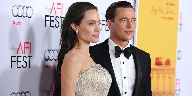 HOLLYWOOD, CA - NOVEMBER 05:  Angelina Jolie and Brad Pitt attend the premiere of 'By the Sea' at the 2015 AFI Fest at TCL Chinese 6 Theatres on November 5, 2015 in Hollywood, California.  (Photo by Jason LaVeris/FilmMagic)