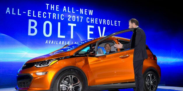 President Barack Obama sits in a new Chevrolet Bolt electric car as he visits the 2016 North American International Auto Show in Detroit, Wednesday, Jan. 20, 2016, to highlight the progress made by the American auto industry. (AP Photo/Carolyn Kaster)