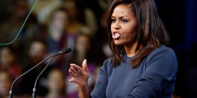 First lady Michelle Obama speaks during a campaign rally for Democratic presidential candidate Hillary Clinton Thursday, Oct. 13, 2016, in Manchester, N.H. (AP Photo/Jim Cole)