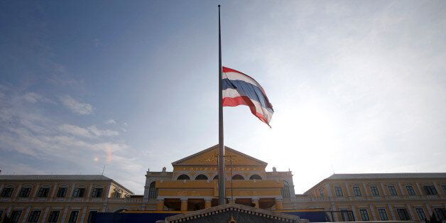 The Thai national flag flutters at half mast at the Ministry of Defence following the passing of King Bhumibol Adulyadej, in Bangkok, Thailand October 14, 2016. REUTERS/Edgar Su