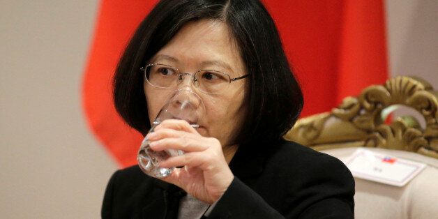 Taiwan's President Tsai Ing-wen drink water during an interview in Luque, Paraguay, June 28, 2016. REUTERS/Jorge Adorno