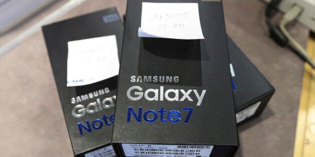 Returned boxes of Samsung Electronics' Galaxy Note 7 smartphones are placed at a shop of South Korean mobile carrier in Seoul, South Korea, Thursday, Oct. 13, 2016. Samsung Electronics says it has expanded its recall of Galaxy Note 7 smartphones in the U.S. to include all replacement devices the company offered as a presumed safe alternative after the original Note 7s were found prone to catch fire. (AP Photo/Lee Jin-man)