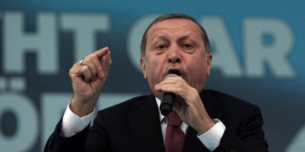 Turkey's President Recep Tayyip Erdogan addresses his supporters during a ceremony for a new train station building on Republic Day in Ankara, Turkey, Saturday, Oct. 29, 2016.(AP Photo/Burhan Ozbilici)
