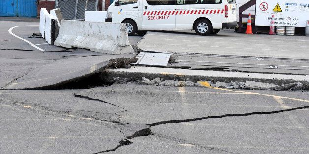 Fissures run along a road by the Centre Port in Wellington, Monday, November 14, 2016, after a major earthquake struck New Zealand's south Island early Monday.  A powerful earthquake struck in a mostly rural area close to the city of Christchurch but appeared to be more strongly felt in the capital, Wellington, more than 200 Km (120 miles) away. (Ross Setford/SNPA via AP)