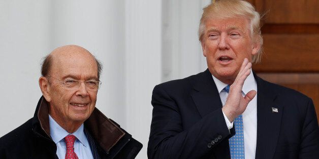 President-elect Donald Trump calls out to media as he greets investor Wilbur Ross at the Trump National Golf Club Bedminster clubhouse, Sunday, Nov. 20, 2016, in Bedminster, N.J.. (AP Photo/Carolyn Kaster)