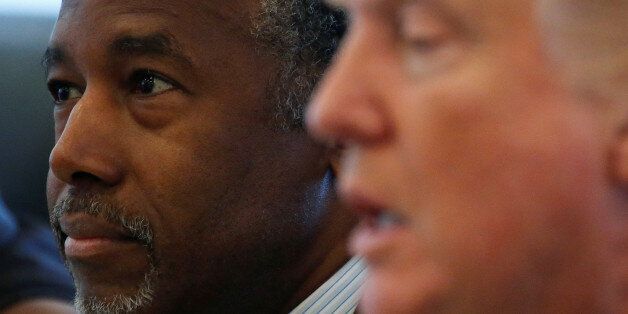 Dr. Ben Carson (L) and Republican presidential nominee Donald Trump speak during a round table with the Republican Leadership Initiative at Trump Tower in the Manhattan borough of New York, U.S., August 25, 2016.   REUTERS/Carlo Allegri