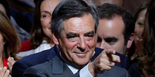 Francois Fillon, former French prime minister and member of Les Republicains political party, attends a rally as he campaigns in the second round for the French center-right presidential primary election in Paris, France, November 25, 2016.  REUTERS/Philippe Wojazer