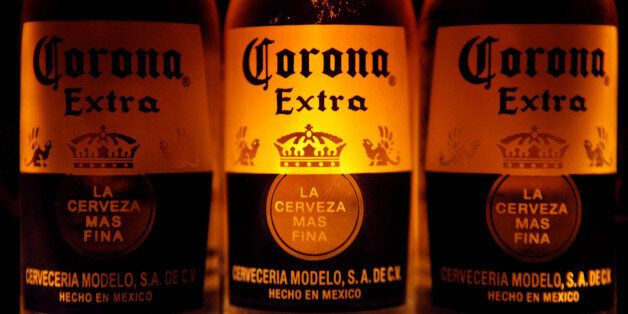 Bottles of Corona beer, the flagship brand of Group Modelo, are seen in Mexico City February 14, 2013.   REUTERS/Edgard Garrido/File Photo                  FROM THE FILES PACKAGE - SEARCH