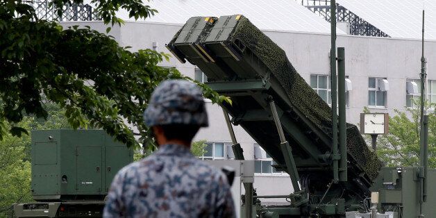 A Japan Self-Defence Forces soldier walks past Patriot Advanced Capability-3 (PAC-3) missile at the Defense Ministry in Tokyo, Japan, May 31, 2016  REUTERS/Toru Hanai