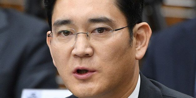 Samsung Group's heir-apparent Lee Jae-yong answers a question during a parliamentary probe into a scandal engulfing President Park Geun-Hye at the National Assembly in Seoul on December 6, 2016.The publicity-shy heads of South Korea's largest conglomerates faced their worst nightmare on December 6, as they were publicly grilled about possible corrupt practises before an audience of millions. REUTERS/Jung Yeon-Je/Pool