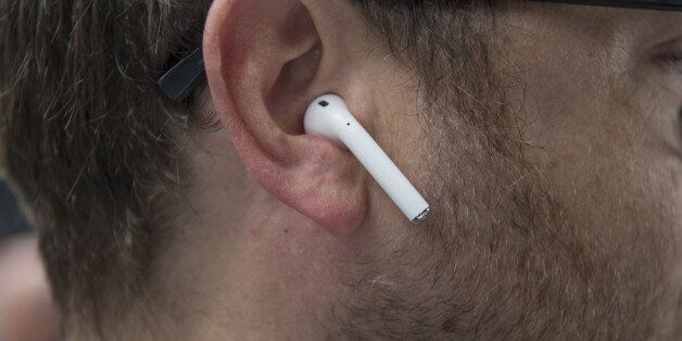 An attendee wears Apple Inc. AirPod wireless headphones during an event in San Francisco, California, U.S., on Wednesday, Sept. 7, 2016. Apple Inc. unveiled new iPhone models Wednesday, featuring a water-resistant design, upgraded camera system and faster processor, betting that after six annual iterations it can still make improvements enticing enough to lure buyers to their next upgrade. Photographer: David Paul Morris/Bloomberg via Getty Images