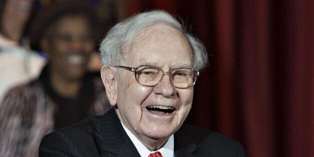 Warren Buffett, chairman and chief executive officer of Berkshire Hathaway Inc., smiles during an event with Hillary Clinton, former Secretary of State and 2016 Democratic presidential candidate, not pictured, at Sokol Auditorium in Omaha, Nebraska, U.S., on Wednesday, Dec. 16, 2015. Buffet said at the rally that he was supporting Clinton's bid for president because they share a commitment to help the less affluent. Photographer: Daniel Acker/Bloomberg via Getty Images