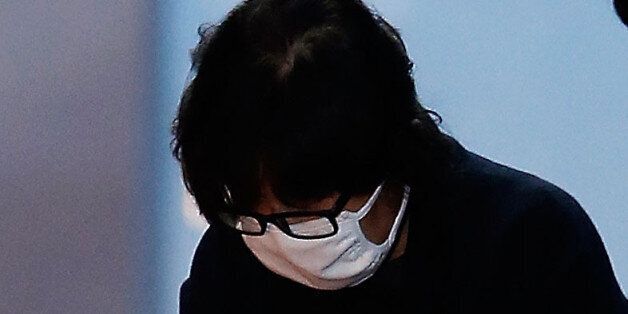 SEOUL, SOUTH KOREA - NOVEMBER 03:  Choi Soon-Sil, a confidant of South Korean President Park Geun-Hye, is to get on a bus of Ministry of Justice as she leaves the Seoul Central District Court on November 3, 2016 in Seoul, South Korea. The prosecutors was issued an arrest warrant for Choi Soon-sil for allegedly influencing state affairs and embezzling money by taking advantage of her close relationship with President Park Geun-hye.  (Photo by Korea Pool/Getty Images)