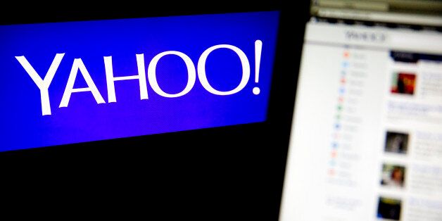 The Yahoo! Inc. logo and website are displayed on laptop computers in this arranged photograph in Washington, D.C., U.S., on Tuesday, April 15, 2014. Yahoo! Inc. expected to release earnings figures after the market close on April 15. Photographer: Andrew Harrer/Bloomberg via Getty Images