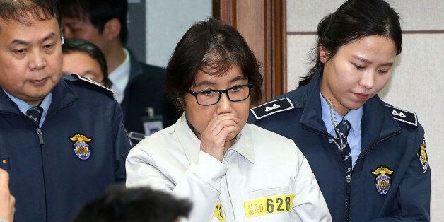 SEOUL, SOUTH KOREA - DECEMBER 19:  (SOUTH KOREA OUT) Choi Soon-Sil, the jailed confidante of disgraced South Korean President Park Geun-Hye, appears for the first day of her trial at the Seoul Central District Court on December 19, 2016 in Seoul, South Korea. Choi Soon-sil, the close friend of President Park Geun-hye, who is at the center of possible corruption scandal that has been leading the president's impeachment appeared at the first court hearing.  (Photo by Korea Pool via Getty Images)