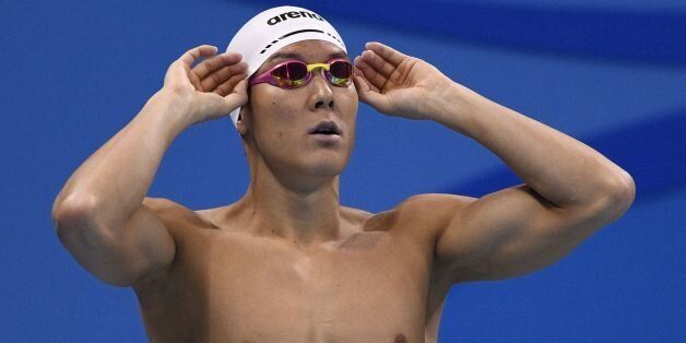 South Korea's Park Taehwan prepares for the Men's 200m Freestyle heats during the swimming event at the Rio 2016 Olympic Games at the Olympic Aquatics Stadium in Rio de Janeiro on August 7, 2016.   / AFP / Martin BUREAU        (Photo credit should read MARTIN BUREAU/AFP/Getty Images)