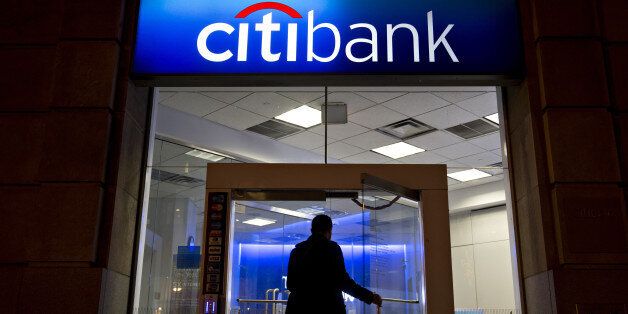 A man walks into a Citigroup Inc. Citibank branch in Washington, D.C., U.S., on Thursday, Jan. 7, 2016. Citigroup Inc. is expected to report fourth-quarter earnings on January 15. Photographer: Andrew Harrer/Bloomberg via Getty Images