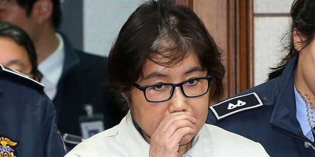 SEOUL, SOUTH KOREA - DECEMBER 19:  (SOUTH KOREA OUT) Choi Soon-Sil, the jailed confidante of disgraced South Korean President Park Geun-Hye, appears for the first day of her trial at the Seoul Central District Court on December 19, 2016 in Seoul, South Korea. Choi Soon-sil, the close friend of President Park Geun-hye, who is at the center of possible corruption scandal that has been leading the president's impeachment appeared at the first court hearing.  (Photo by Korea Pool via Getty Images)