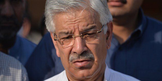 Pakistani Defence Minister Khawaja Asif speaks with media after meeting with patients, who were injured during cross-border shelling, at a military hospital in the eastern city of Sialkot on August 29, 2015. Pakistan will respond 'with full force' if India continues to target the civilian population, Islamabad's defence minister said, after 13 people died when rivals traded fire across their disputed border. Nine died near the city of Sialkot in Pakistan's Punjab province, and more than 40 were