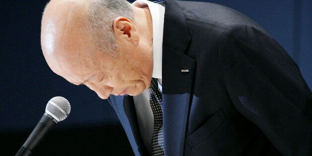 Tadashi Ishii, president of Japan's top advertising agency Dentsu Inc, bows during a news conference in Tokyo, Japan, in this photo taken by Kyodo December 28, 2016. Picture taken December 28, 2016. Mandatory credit Kyodo/via REUTERS ATTENTION EDITORS - THIS IMAGE WAS PROVIDED BY A THIRD PARTY. EDITORIAL USE ONLY. MANDATORY CREDIT. JAPAN OUT. NO COMMERCIAL OR EDITORIAL SALES IN JAPAN.     TPX IMAGES OF THE DAY