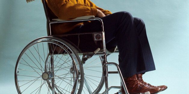 1970s AFRICAN AMERICAN MAN SITTING WHEELCHAIR  (Photo by H. Armstrong Roberts/ClassicStock/Getty Images)