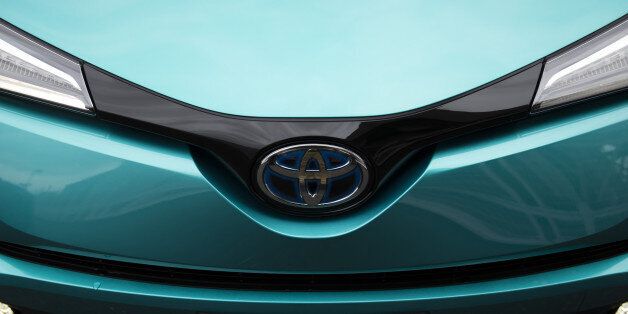 A Toyota Motor Corp. C-HR hybrid sport utility vehicle (SUV) is displayed in a parking lot during a media event held ahead of the sales launch in Tokyo, Japan, on Tuesday, Dec. 13, 2016. The new C-HR models designers applied a sexy diamond theme inside and out, from the sharply sloped rear window to the rhombus-patterned door trim, chief engineer Hiroyuki Koba told reporters Wednesday in Tokyo. Photographer: Tomohiro Ohsumi/Bloomberg via Getty Images