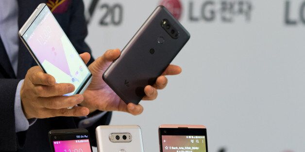 Cho Jun-Ho, chief executive officer of Mobile Communications at LG Electronics Inc., holds the company's V20 smartphones during a launch event in Seoul, South Korea, on Wednesday, Sept. 7, 2016. The V20 will go on sale in South Korea starting this month, with other regions to follow, according to the company. Photographer: SeongJoon Cho/Bloomberg via Getty Images