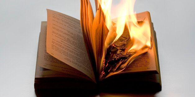 Burning book on white background. It refers to disregard for wisdom, history and knowledge. It points out to Fascist movement. It can refer to anarchy and punk.