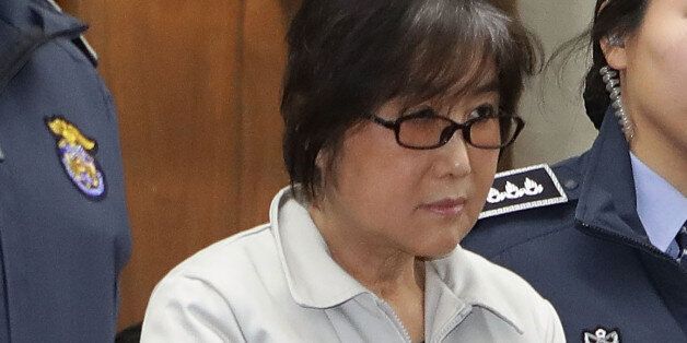 SEOUL, SOUTH KOREA - JANUARY 5:  Choi Soon-sil, the jailed confidante of disgraced South Korean President Park Geun-Hye, appears for her first trial at the Seoul Central District Court on January 5, 2017 in Seoul, South Korea. Choi Soon-sil, the close friend of President Park Geun-hye, who is at the center of possible corruption scandal that has been leading the president's impeachment appeared at the court hearing.  (Photo by Chung Sung-Jun/Getty Images)