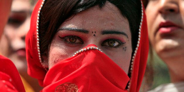 A Pakistani transvestite takes a part in a rally with others to support their arrested colleague Raani, whose real name was given as Kashif, in Peshawar June 3, 2010. Pakistani police arrested what they said last week was an entire wedding party at a ceremony between a man and a transvestite, accusing the pair of promoting homosexuality in the devoutly Muslim country. REUTERS/Fayaz Aziz   (PAKISTAN - Tags: POLITICS CIVIL UNREST SOCIETY)