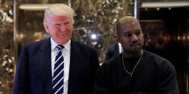 U.S. President-elect Donald Trump and musician Kanye West pose for media at Trump Tower in Manhattan, New York City, U.S., December 13, 2016.  REUTERS/Andrew Kelly