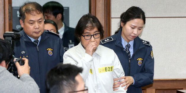 Choi Soon-sil, a long-time friend of South Korean President Park Geun-hye who is at the center of the South Korean political scandal involving Park, arrives for her first court hearing in Seoul, South Korea, December 19, 2016. Korea Pool/via REUTERS  ATTENTION EDITORS - THIS IMAGE HAS BEEN SUPPLIED BY A THIRD PARTY. SOUTH KOREA OUT.