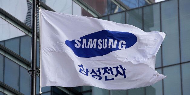 SEOUL, SOUTH KOREA - JANUARY 12:  A Samsung flag flies outside the company's headquarters on January 12, 2017 in Seoul, South Korea. The independent counsel team investigating the peddling scandal involving South Korean President Park Geun-hye and her confidant Choi Soon-sil summoned Samsung Group Vice Chairman Lee Jae-yong for questioning on charges of perjury as he allegedly lied about the money Samsung donated to Choi through multiple channels in the parliamentary hearings last month.  (Photo