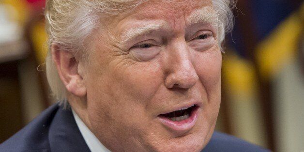 US President Donald Trump speaks during a meeting with automobile industry leaders in the Roosevelt Room of the White House in Washington, DC, January 24, 2017. / AFP / SAUL LOEB        (Photo credit should read SAUL LOEB/AFP/Getty Images)