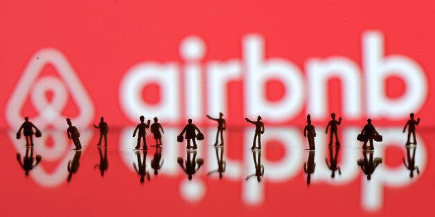 REFILE-CORRECTING GRAMMAR A 3D printed people's models are seen in front of a displayed Airbnb logo in this illustration taken, June 8, 2016. REUTERS/Dado Ruvic/Illustration TPX IMAGES OF THE DAY