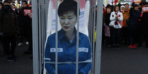 SEOUL, SOUTH KOREA - DECEMBER 10: Protesters gathered and occupy major streets in the city center for a rally against South Korean President Park Geun-Hye on December 10, 2016 in Seoul, South Korea. The South Korean National Assembly voted yesterday for an impeachment motion at its plenary session, which will set up the rare impeachment trial for President Park over the accusation of corruption involving Park and her long time confidante.  (Photo by Chung Sung-Jun/Getty Images)